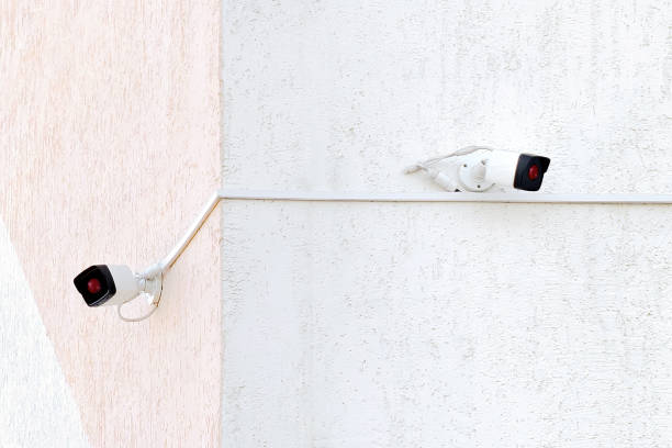 istock Security surveillance cameras on corner of building 1258163800