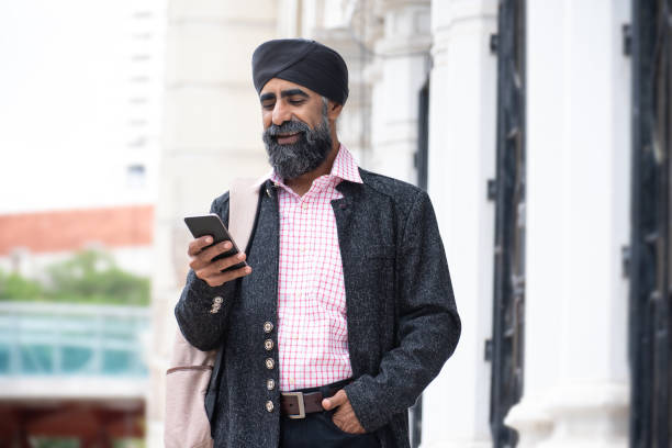 istock Silk businessman with turban using smart phone 1258165869