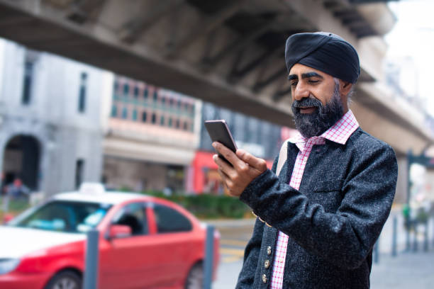 istock A Sikh businessman with turban using smart phone for e-healing on street 1258165870