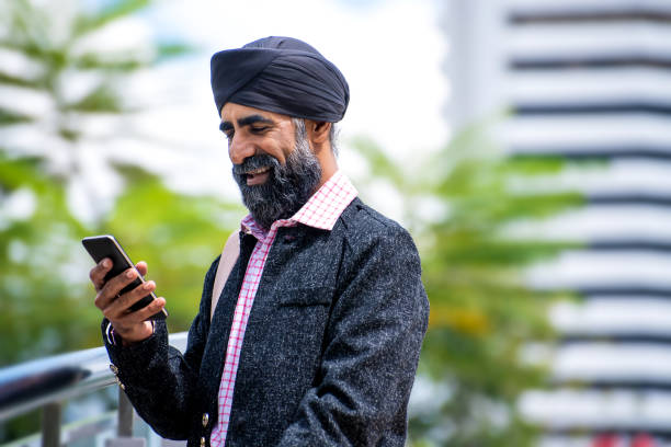 istock Silk businessman with turban using smart phone 1258165885