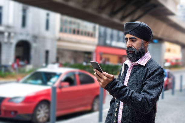 istock A Sikh businessman with turban using smart phone for e-healing on street 1258165893