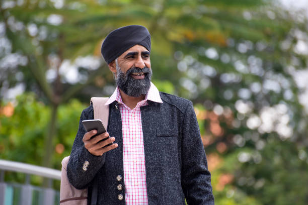 istock Silk businessman with turban using smart phone 1258165923