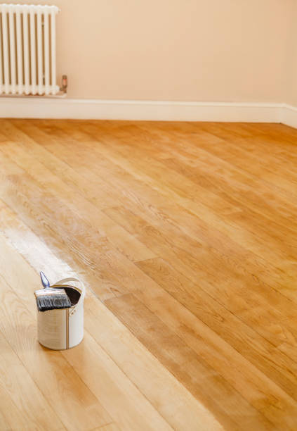 istock Sanding and staining a wooden floor, UK 1258166045