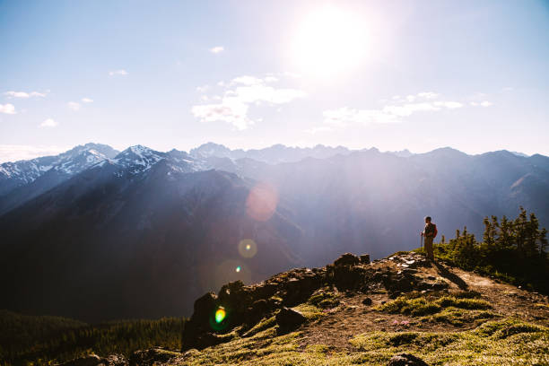 Backpacker Hiking Mountain Ridge With View of Olympics