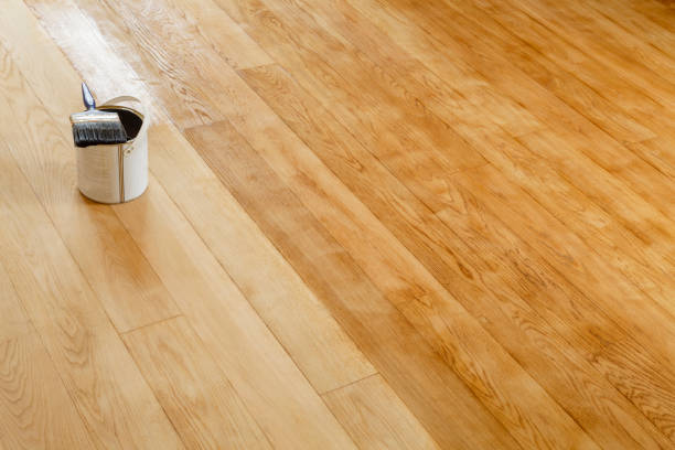 Restore a hardwood floor, UK Restore a hardwood floor, sanding and staining wooden floor in a room, UK wood stain stock pictures, royalty-free photos & images