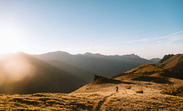 istock Backpacker Hiking Mountain Ridge With View of Olympics 1258167804