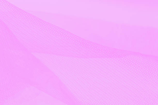 istock Light small mesh fabric on pink background. Shades of pink 1258167806