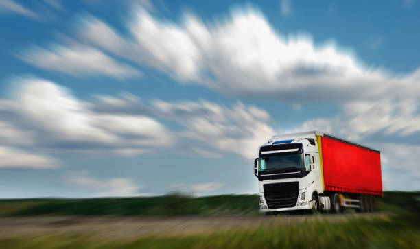 istock Truck with container driving on the asphalt road. 1258167860