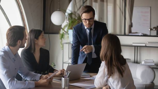 istock Multiracial businesspeople work together at office briefing 1258168144