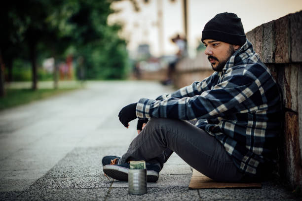 istock Homeless man begging on the street 1258171209