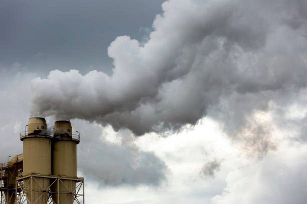 istock Industrial pollution, smoke from factory, background with copy space 1258178712