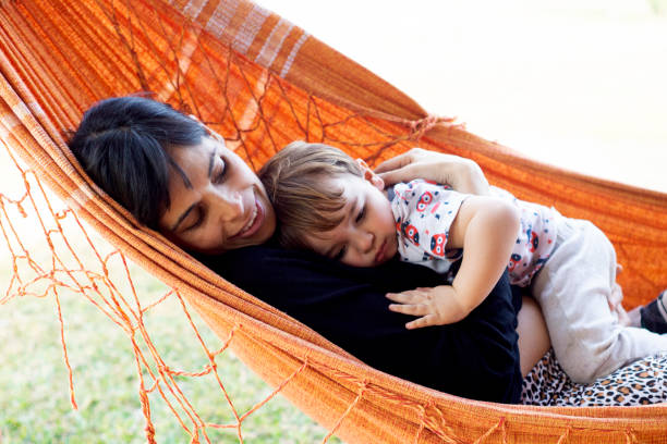 istock mother in hammock with her one-year-old son 1258179558