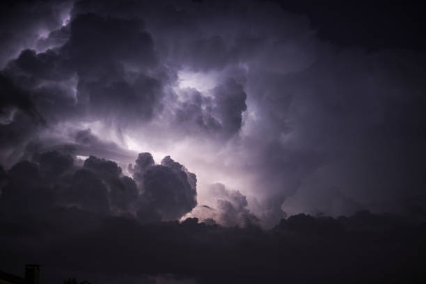 Scary Lightning in The Night Sky Among The Clouds