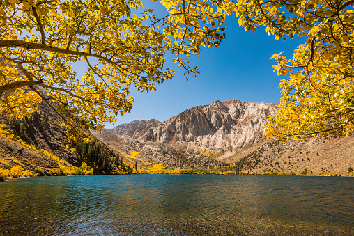 Convict Lake on the East side of the Sierra Nevada Mountains in Mono County and the Inyo National Forest of California. Autumn colors of the aspen trees in the valley.