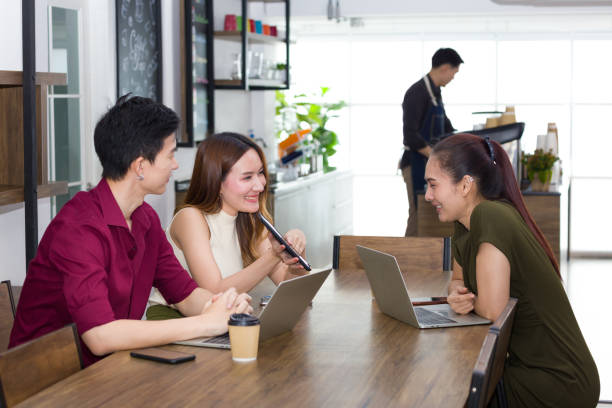 istock Group of young workers talking in a coffee shop. 1258278981