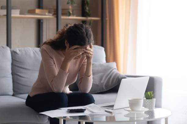 istock Upset young woman frustrated with financial problems 1258280073