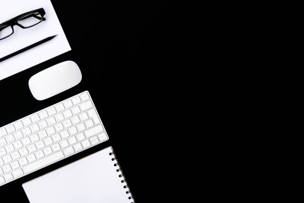 istock Office supplies on black background. 1258284178