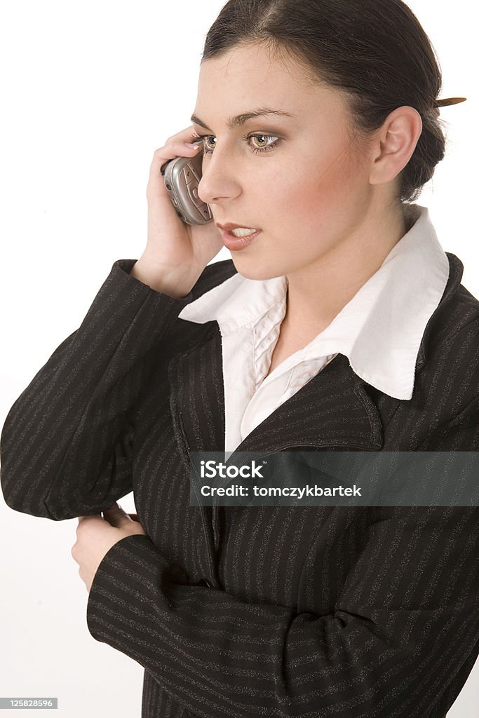 Business woman with telephone Young, beautiful businesswoman speaks by smartphone Adult Stock Photo