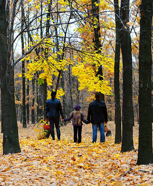 istock Family in autumn forest 125837395