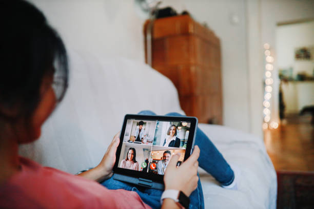istock Back view of a woman having a video conference 1258393932