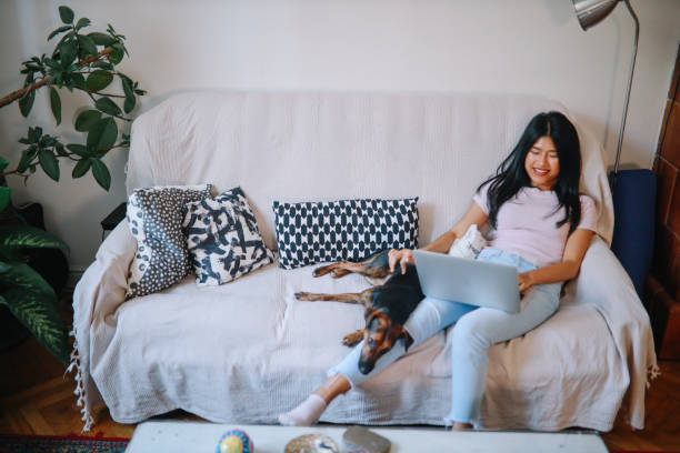istock Young Asian woman working from home 1258401109