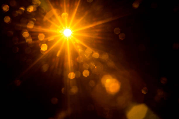 istock Abstract Natural Sun flare on the black 1258426360
