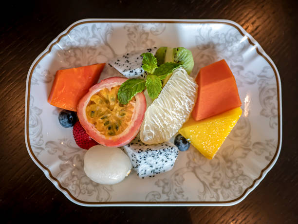 istock Mixed fruits salad top view 1258445741