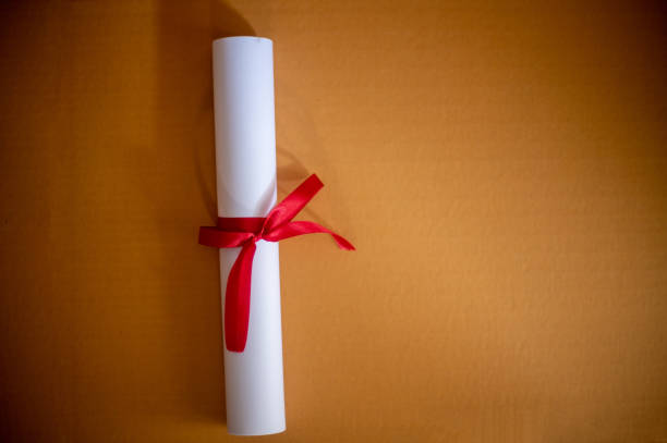 istock Certificate graduation on brown paper,Education concept 1258446877