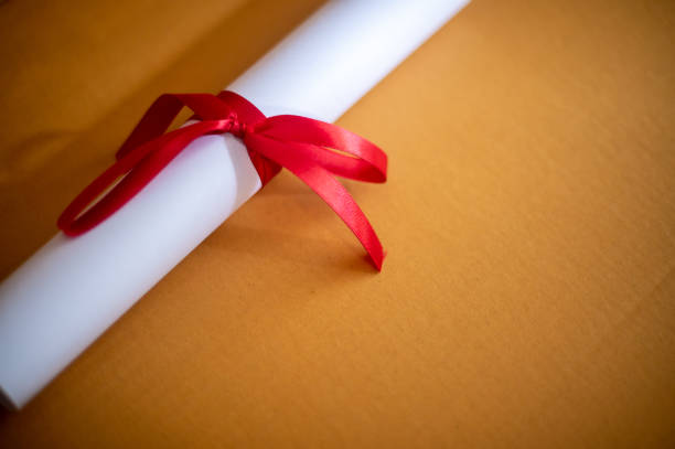 istock Certificate graduation on brown paper,Education concept 1258446879