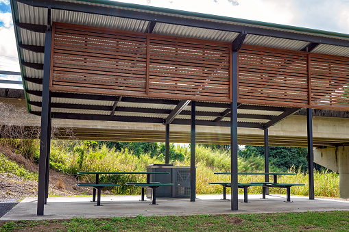 Picnic tables and chairs with barbecue off a country highway for the convenience of travelers