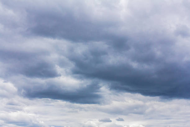 istock Grey rain clouds in the daytime. Bad weather. 1258504909