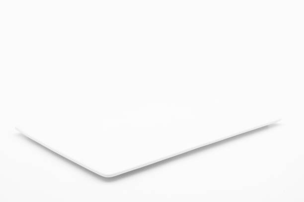 A rectangle empty white plate isolated on the white background. stock photo