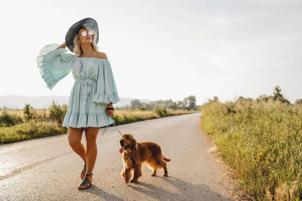 istock Woman walking with her dog 1258530683