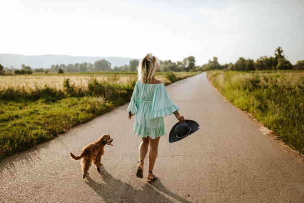 istock Woman walking with her dog 1258534866