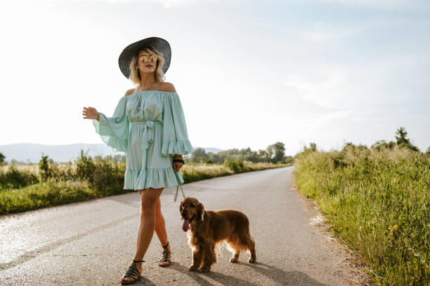 istock Woman walking with her dog 1258536466