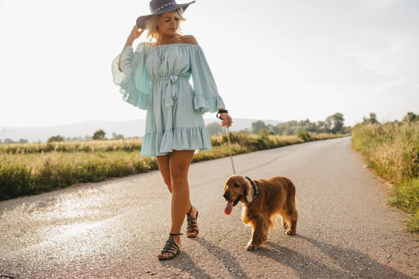 istock Woman walking with her dog 1258537548