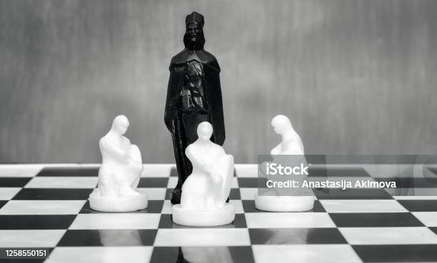 Black And White Chess Pieces On The Chessboard The Concept Of Combating Racism Motivational Poster Against Racism And Discrimination Stock Photo - Download Image Now