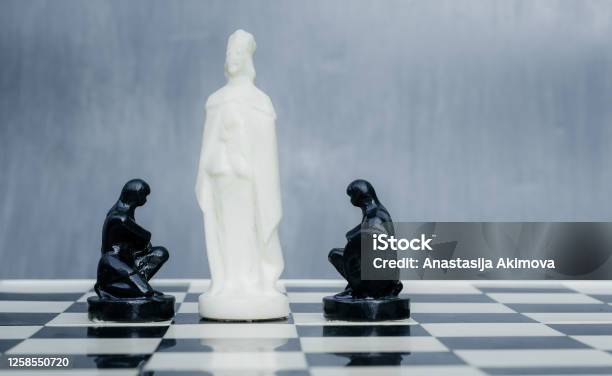 Black And White Chess Pieces On The Chessboard The Concept Of Combating Racism Motivational Poster Against Racism And Discrimination Stock Photo - Download Image Now