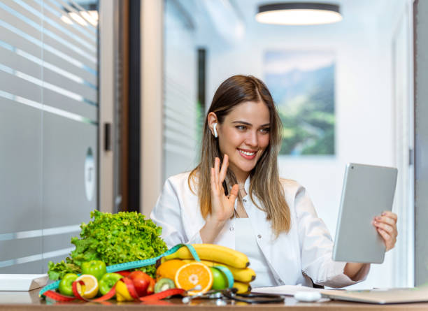 istock Dietician makes video calls with digital tablet 1258554870