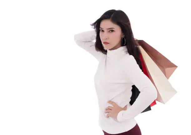 beautiful woman holding shopping bag isolated on a white background