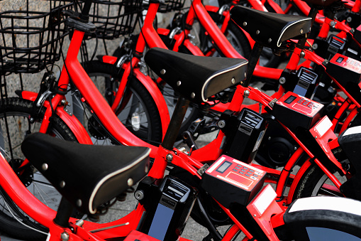 Red bicycles for bike sharing that can be used in each of Japan's major tourist destinations