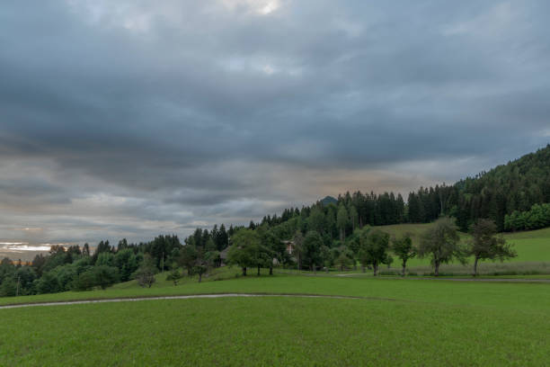 Cloudy Mittagskogel hill in summer fresh blue sky color morning