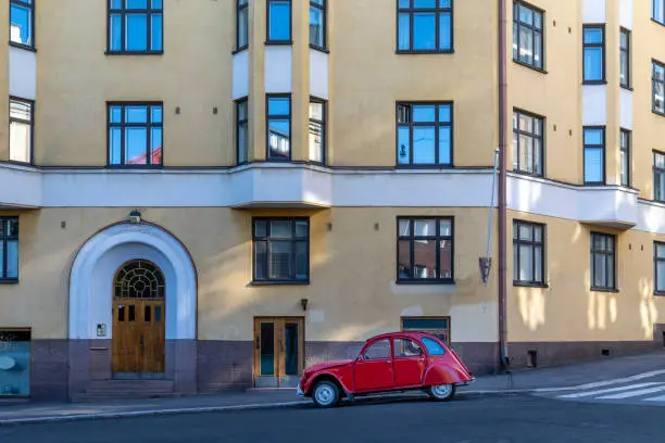 Historical car parked in front of historical building in Helsinki