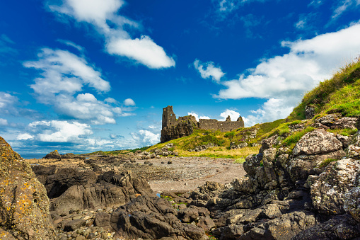 Dunure Castle photographed in the summer from the shore-line. Dunure Castle is a derelict building in Ayrshire, Scotland, UK.