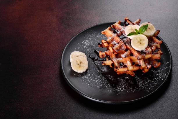 istock Delicious fresh baked belgian waffles with berries and fruit 1258647624