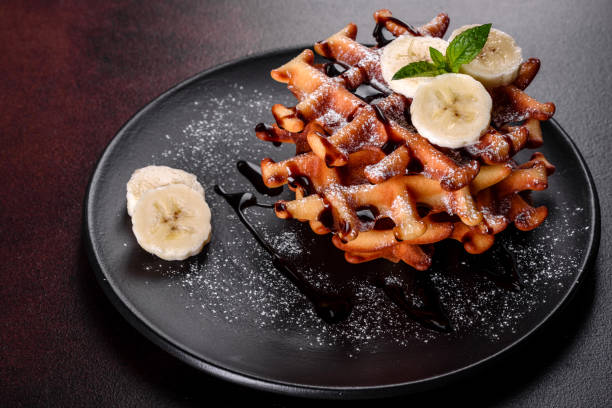 istock Delicious fresh baked belgian waffles with berries and fruit 1258647637