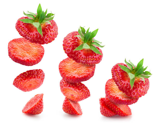istock Strawberry slices isolate. Falling strawberry slices. Strawberry slice on white. Falling, flying berries. 1258677389