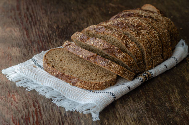 istock Loaf of multigrain bread sliced into pieces. 1258680147