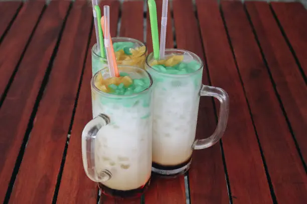 Photo of Es Cendol, Java traditional drink. Cendol is an iced sweet popular dessert that contains droplets of worm-like green rice flour jelly, coconut milk and palm sugar syrup