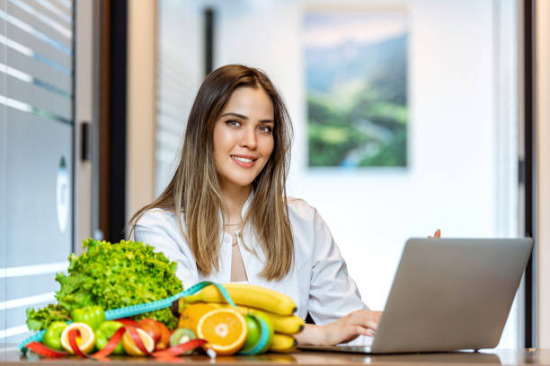 istock Dietician working on diet plan with laptop 1258696752